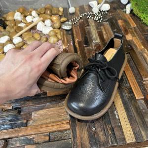 Cozy Tied Cowhide Round Toe Flats