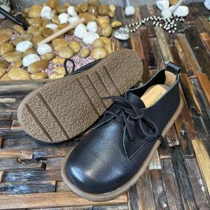 Cozy Tied Cowhide Round Toe Flats